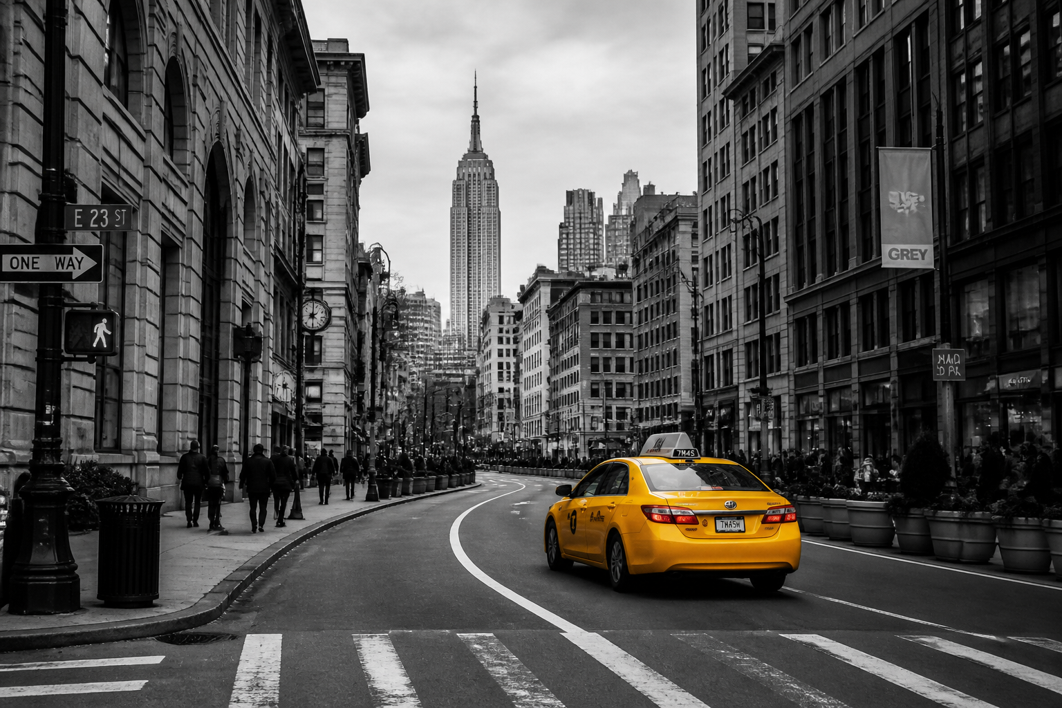 Yellow taxi cab on black and white street illustrating emphasis and movement